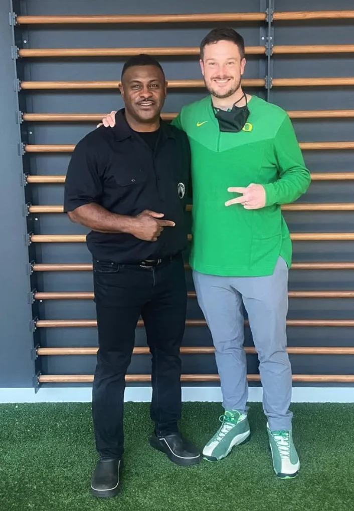 Dino Philyaw with Oregon head football coach Dan Lanning.